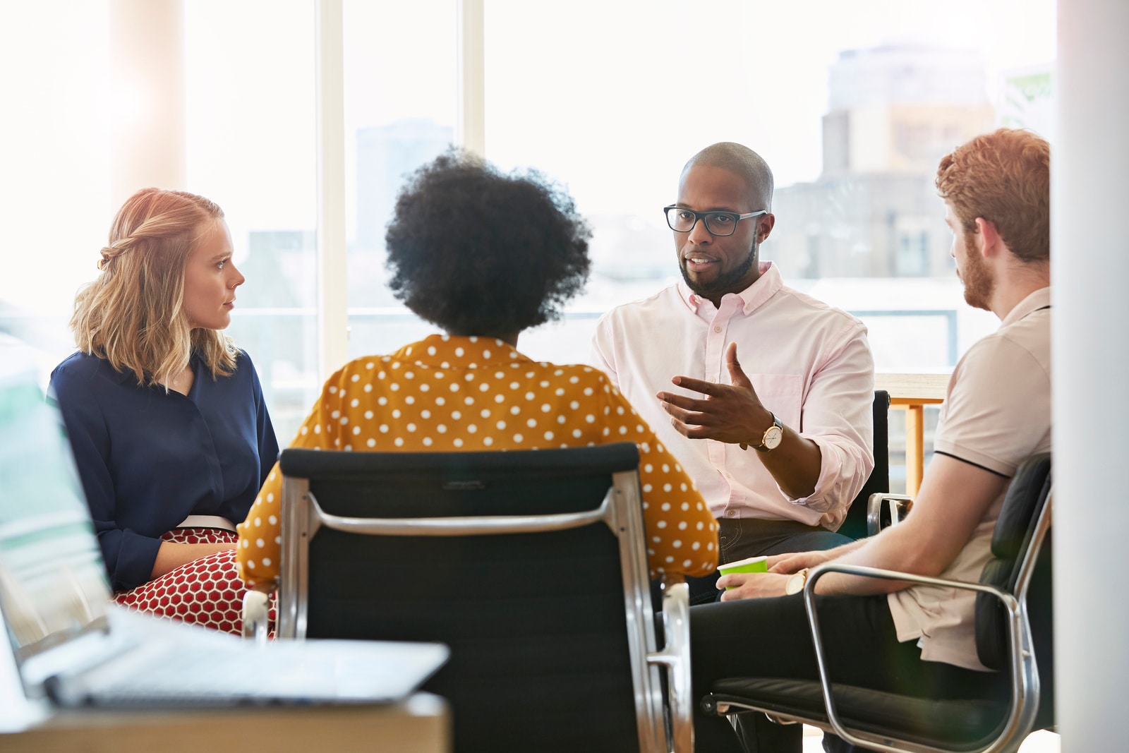 People discussing PwC's Alliance services.